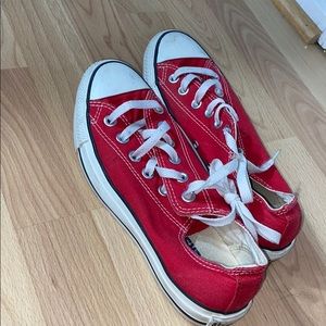 Red low top Converse sneakers